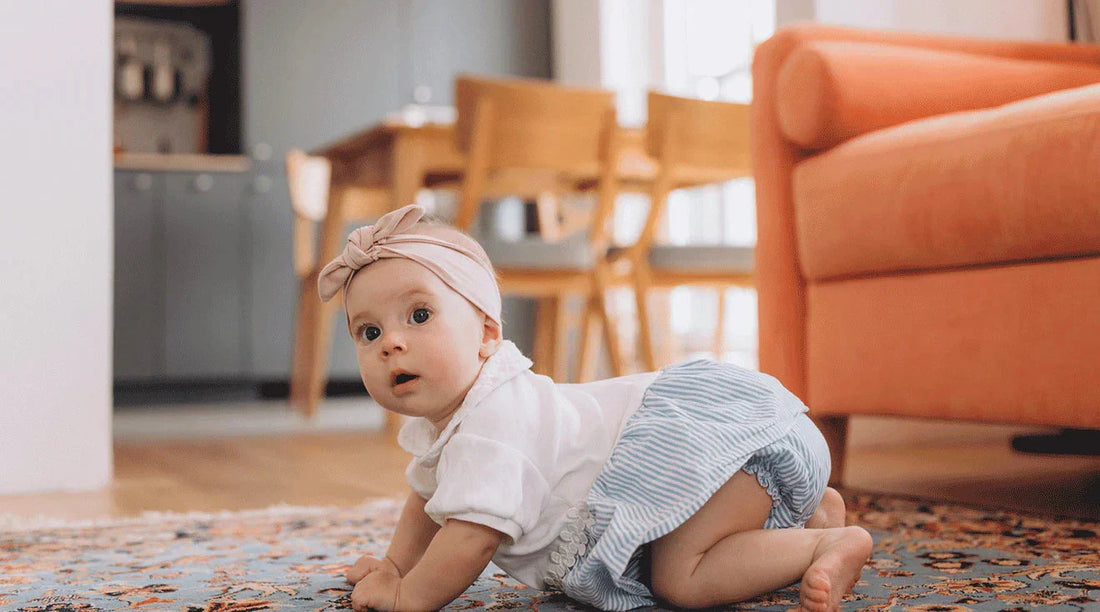 Newborn baby at home in soft natural light during the first days after birth