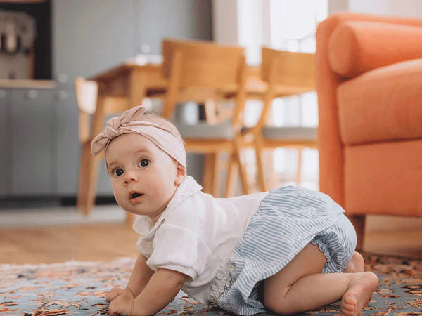 Newborn baby at home in soft natural light during the first days after birth