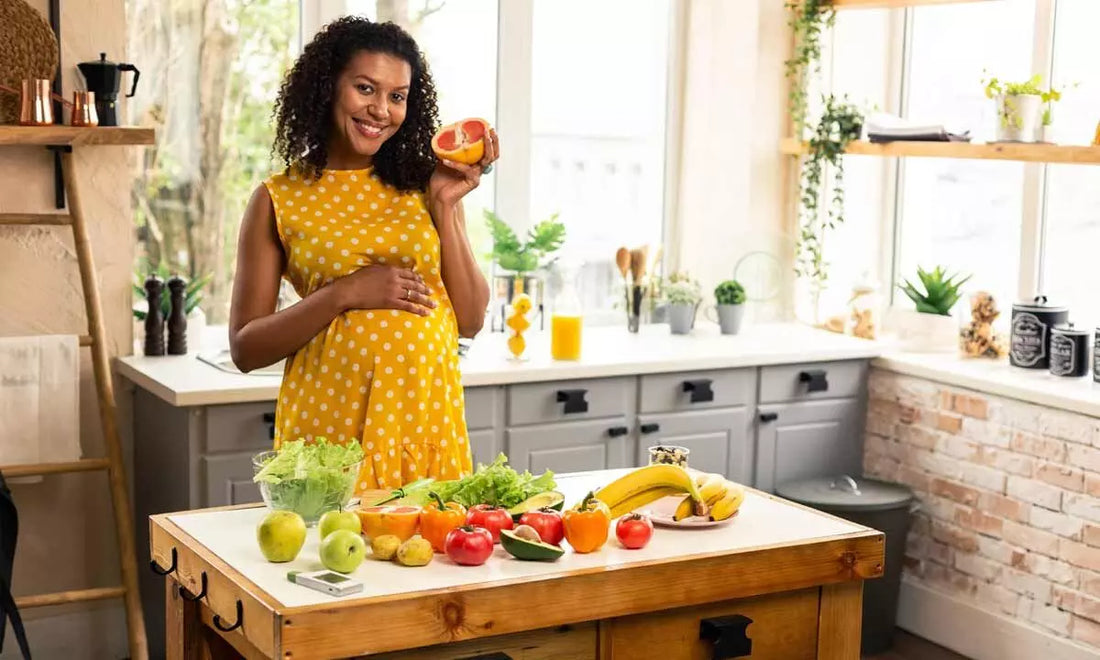 Fresh whole foods including vegetables, fruit and lean protein laid out in a bright kitchen setting