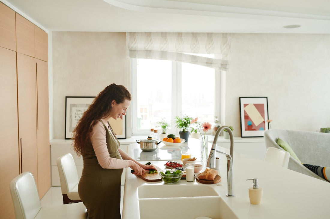 A spread of nutritious whole foods including vegetables, eggs, dairy and fruit on a kitchen surface