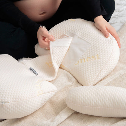 Adjustable maternity pillow expanding with velcro fastening to support growing pregnancy bump